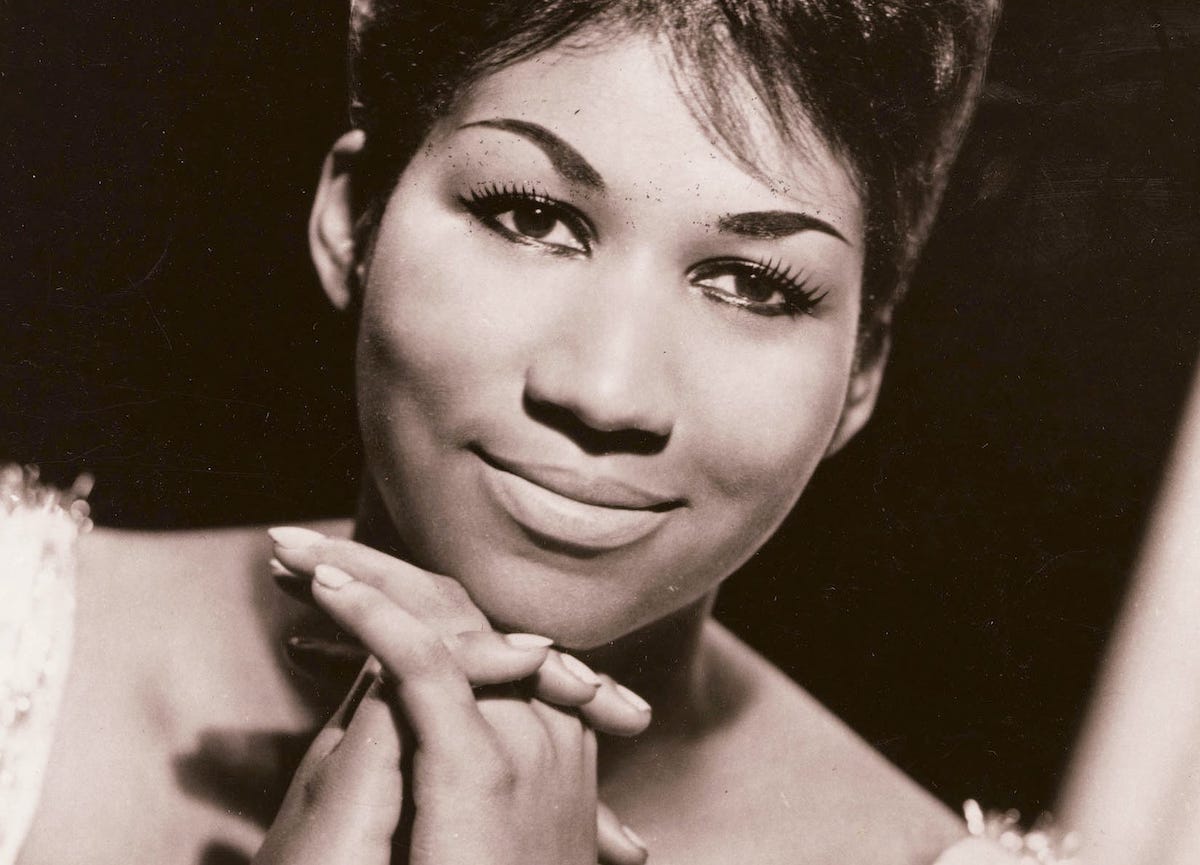 1960s sepia-toned head shot of Aretha Franklin