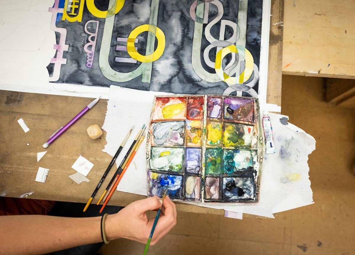 Student prepares work for artshow