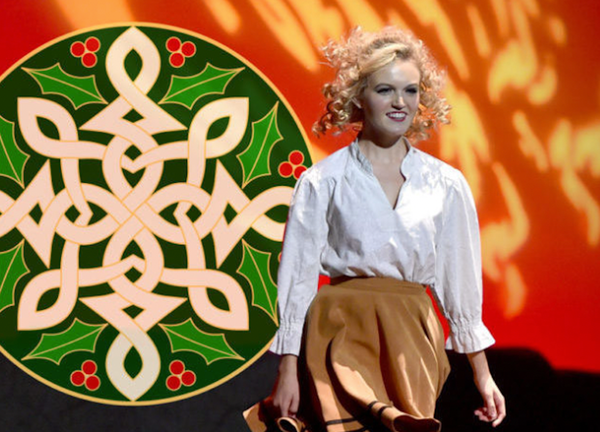 Cast member of "An Irish Christmas" walks out on stage. 