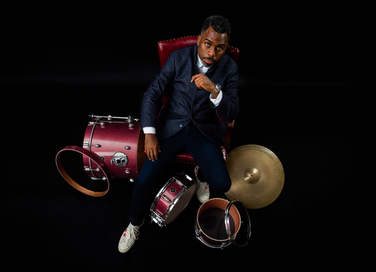 Press photo of Nate Smith with his various percussion instruments