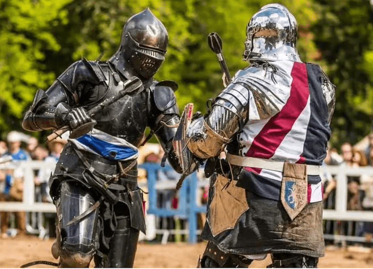 Costumed participants spar at the Renaissance Fair