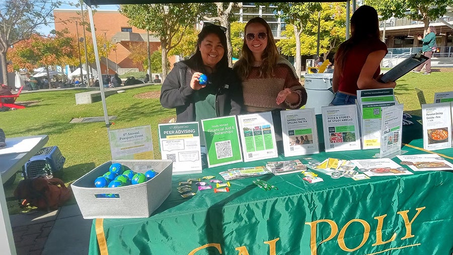 Members of the Cal Poly International Center at a booth during International Education Week.