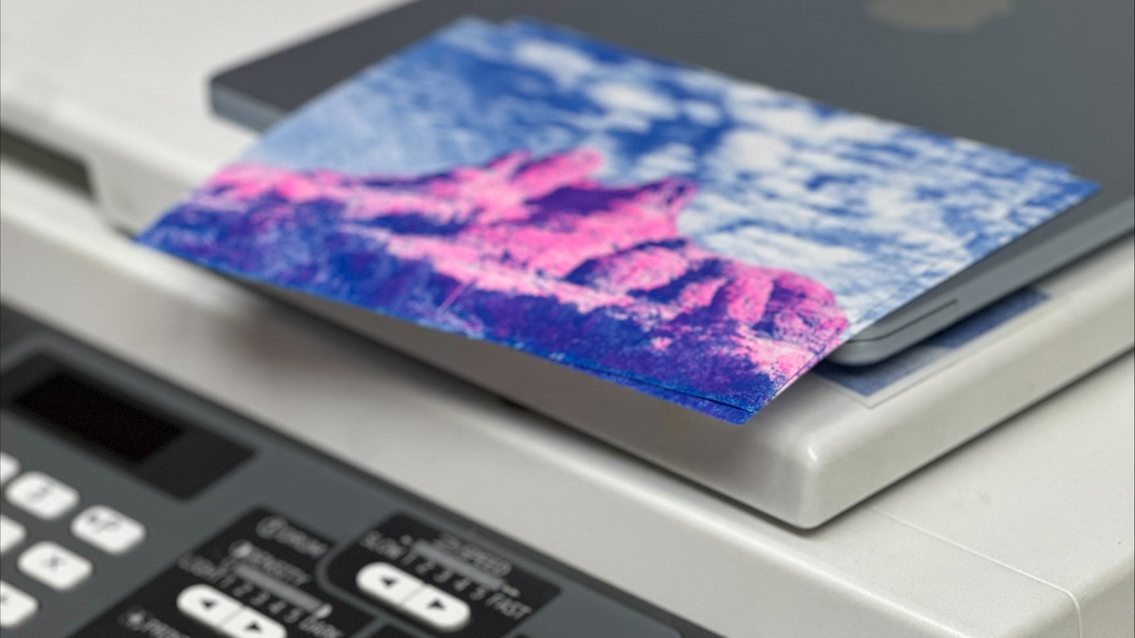 Front panel of a Risograph on top of a printer.