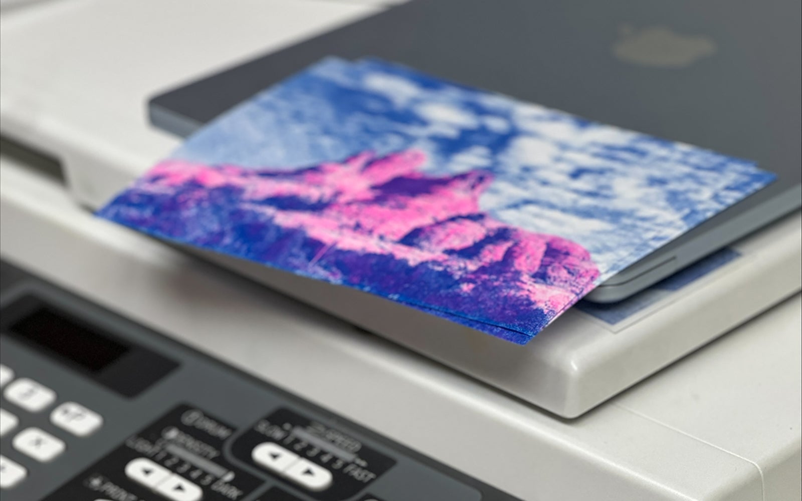 Front panel of a Risograph on top of a printer.