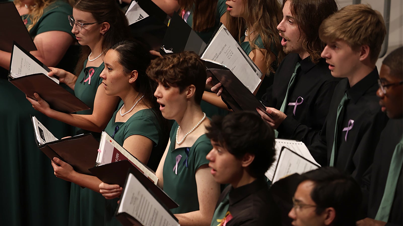 Cal Poly choirs performing on stage.