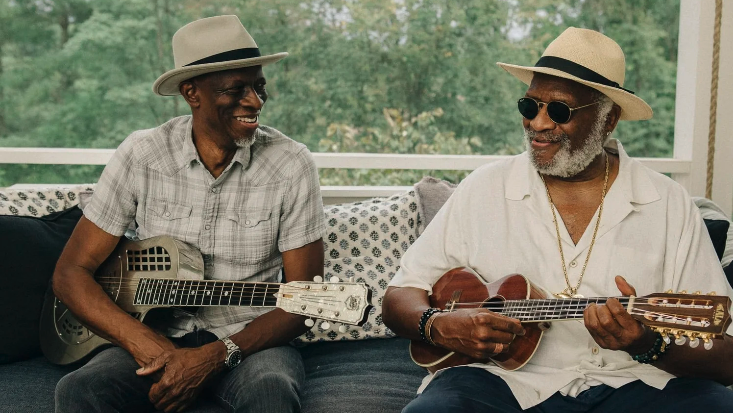 Taj Mahal and Keb' Mo' of TajMo playing guitars.
