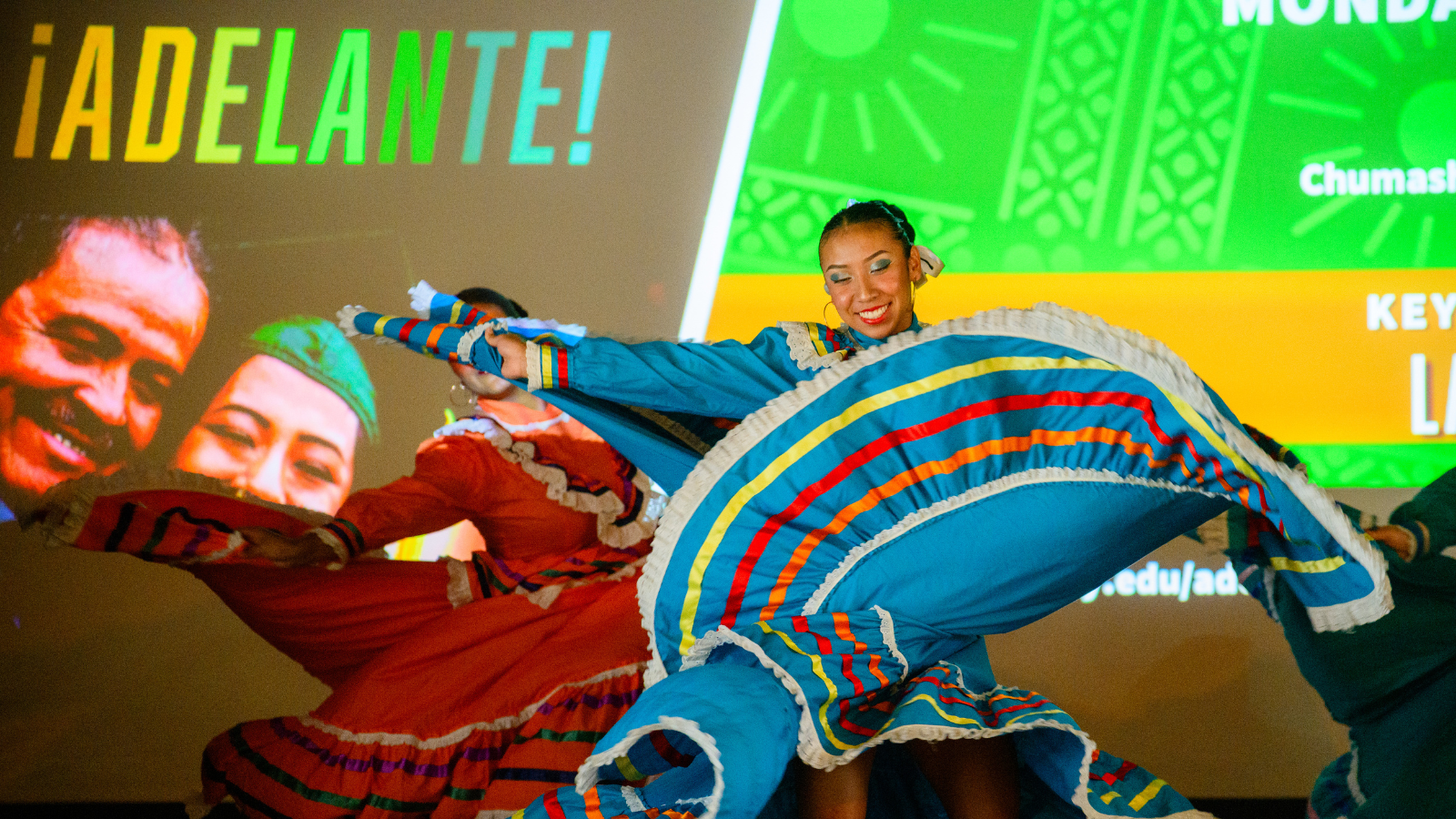 Baile Folklorico performers on stage in Chumash Auditorium at the 2025 HSI Symposium.