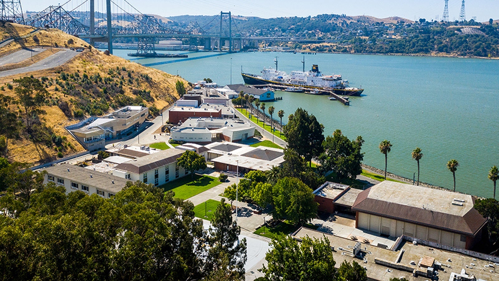 The Cal Poly Maritime Academy campus with Training Ship Golden Bear in the background.