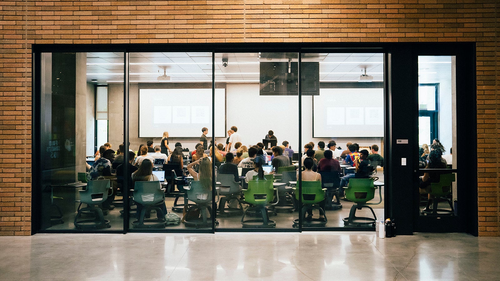 Students build at a Cal Poly Vibe Coding general meeting session. 