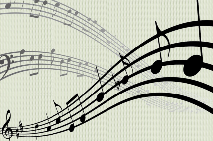 A photo of wavy staff paper containing notes and clefs.