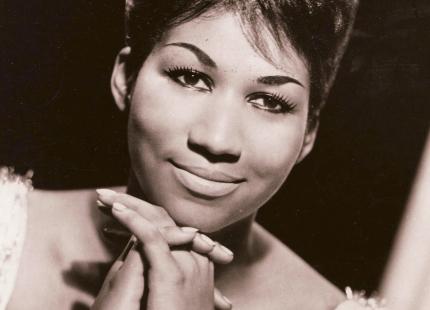 1960s sepia-toned head shot of Aretha Franklin