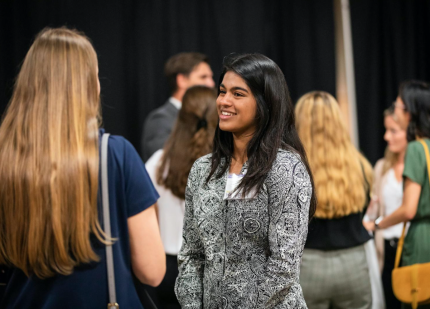 Cal Poly engineering student meets with potential employer at Fall Career Fair.