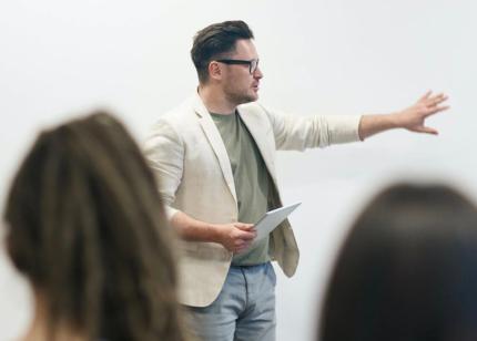 Faculty member holds lecture for computer programming students