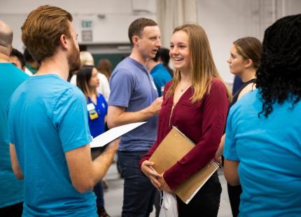 Students speak with potential employers at Cal Poly career fairs