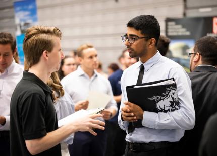 Cal Poly student meets with potential employer at the CAFES Connection Networking Event
