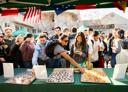 Students sample food from various countries.