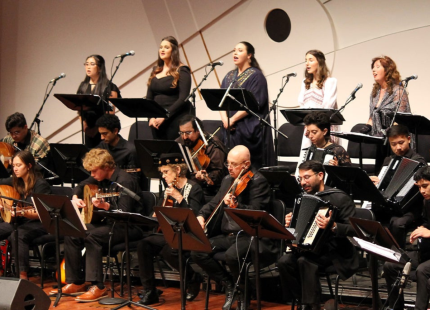 Orchestra playing on stage.