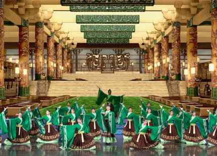 Dancers in bright colors perform on stage.