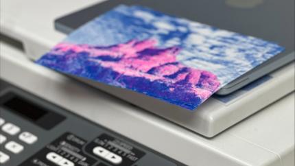 Front panel of a Risograph on top of a printer.