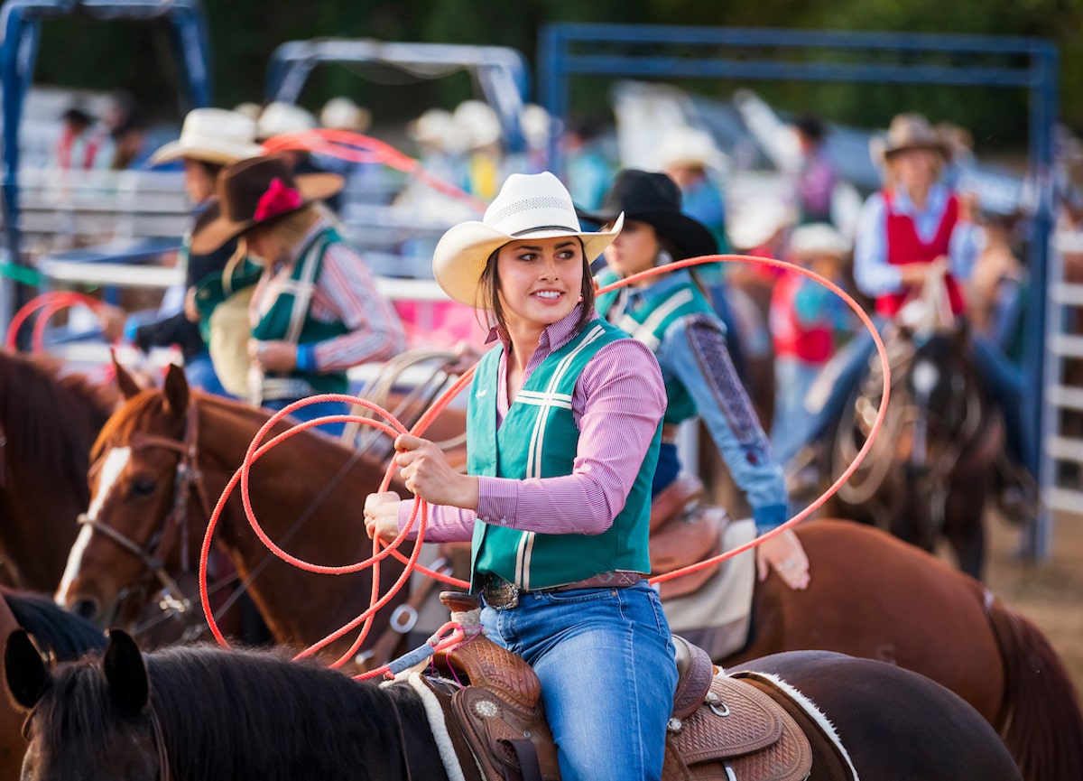 Competing student athlete on horseback at Poly Royal Rodeo 