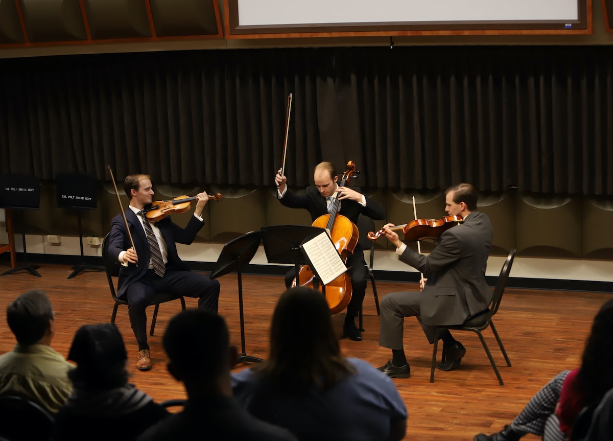String trio plays in recital room at Cal Poly