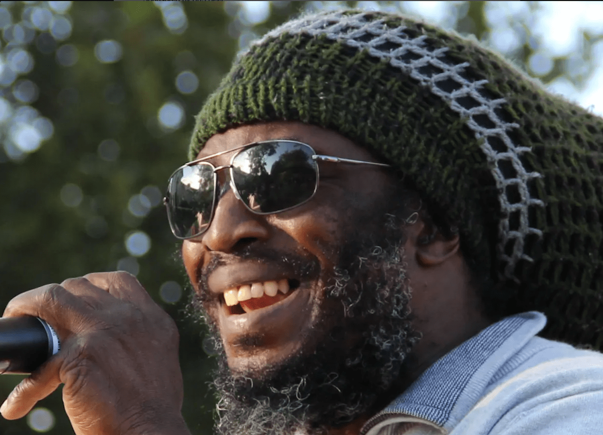 Reggae Vance performing with Resination in outdoor summer concert