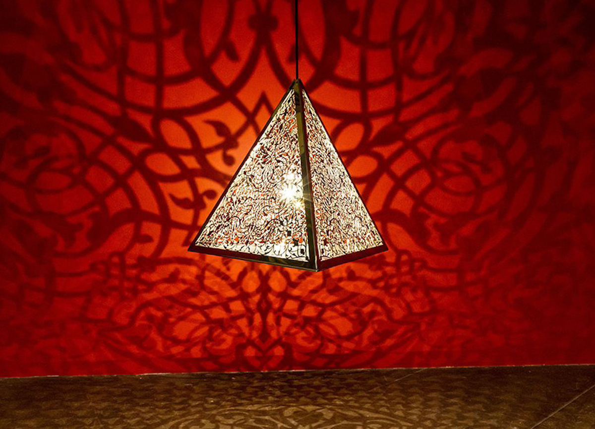 An Anila Quayyum Agha triangle light sculpture