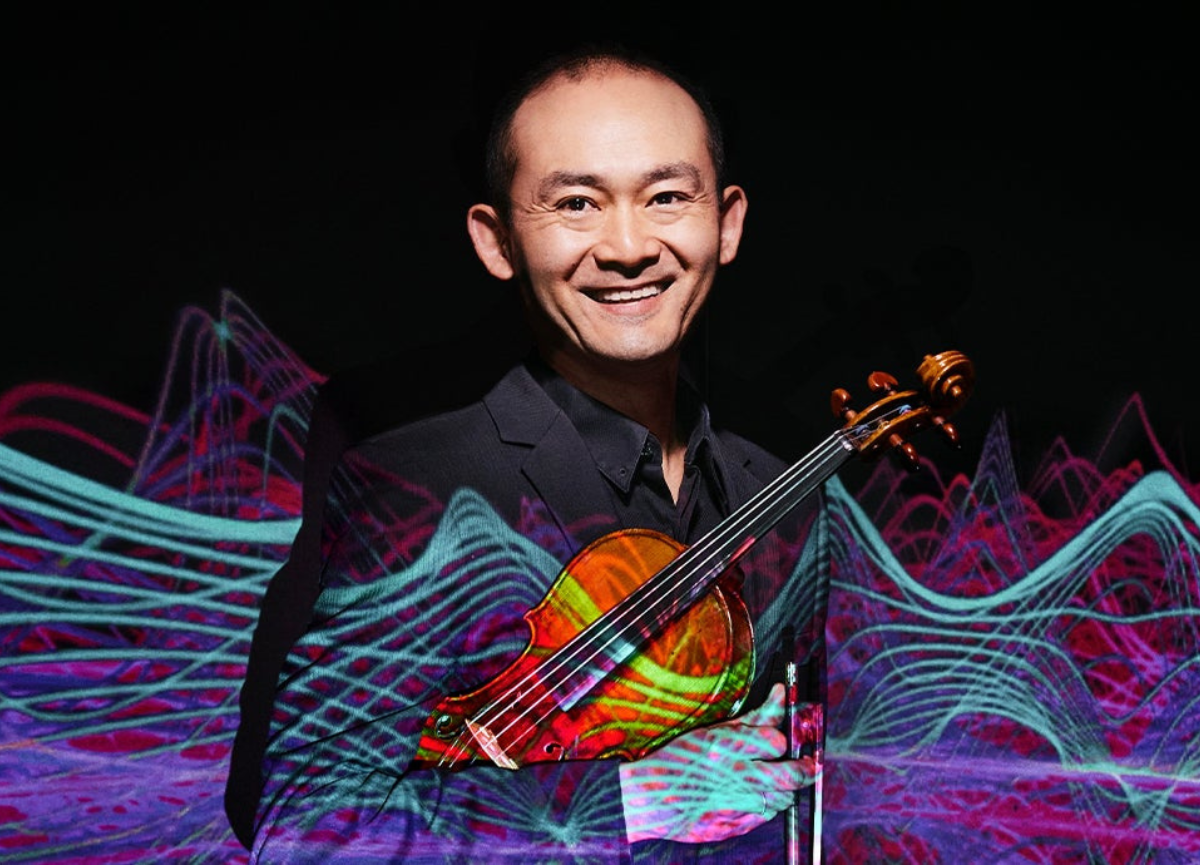 Photo of Chen Zhao with a violin.