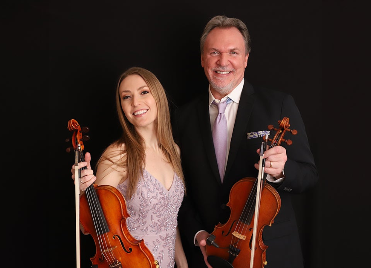 Mark and Maggie O'Connor photographed with their violins.