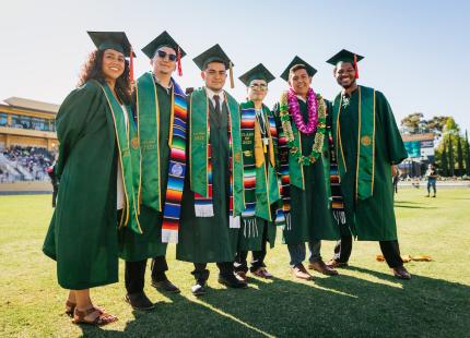 Six College of Engineering graduates pose for photo.