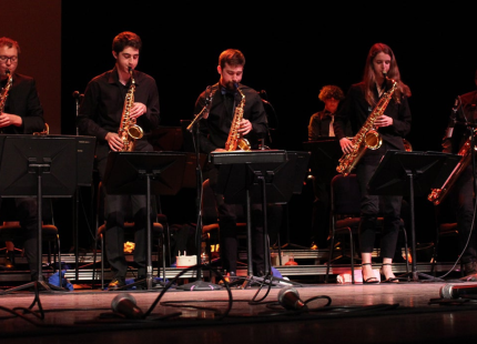 Jazz band plays on stage.