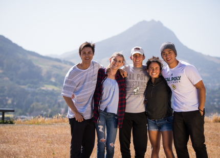 Group of students with San Luis Obispo in background. 